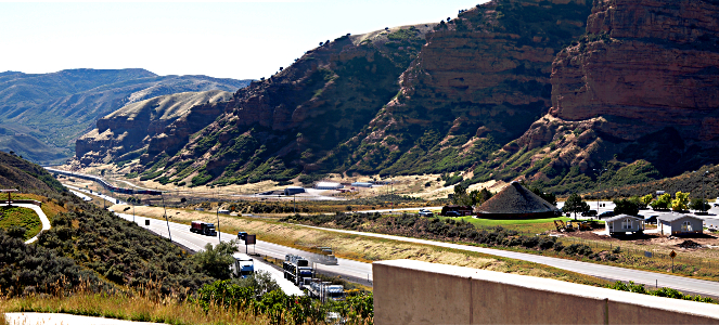 [At this portion of the canyon wall the segmented cliffs transition to smoother flatter hills.]